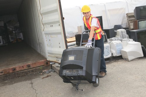 Acton local movers efficiently loading items into a van